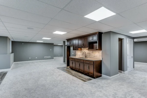 Cool colored basement room with beautiful design ceiling
