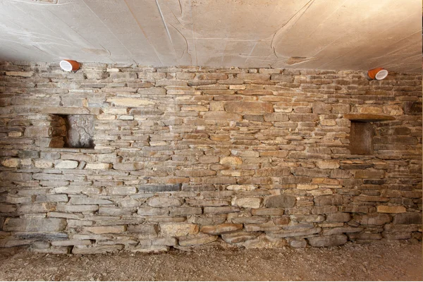 basement interior with fieldstone wall