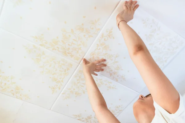 Installing Ceiling Tiles in a Basement - South Shore Basement Finishing